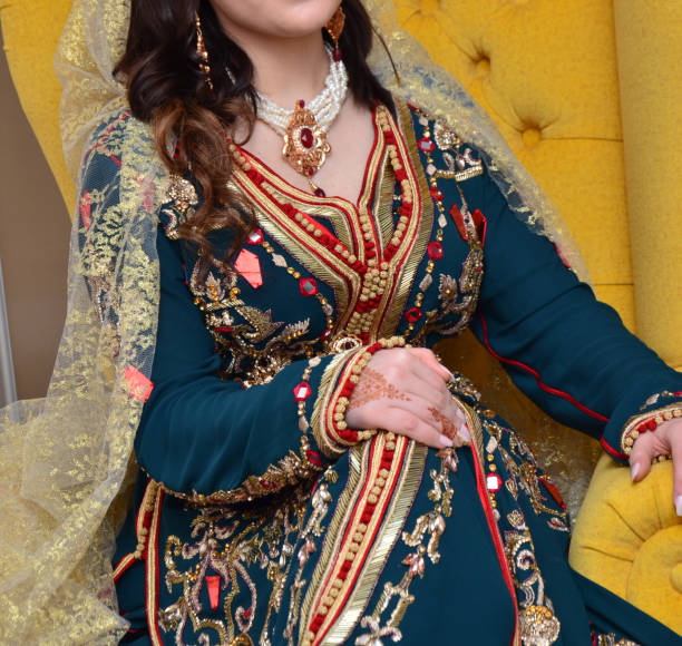 Moroccan traditional dress, embroidery on the caftan. Festive women's clothing in Morocco Moroccan traditional dress, embroidery on the caftan. Festive women's clothing in Morocco moroccan culture photos stock pictures, royalty-free photos & images