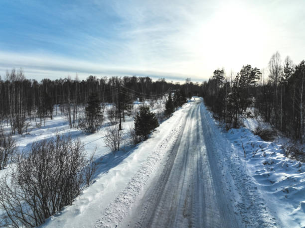istock Road in the winter forest. Aerial view 1389902780