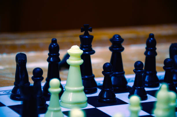 istock Selective focus on the chess pieces on the chess board. Checkmate by queen in chess game at home. 1389903946
