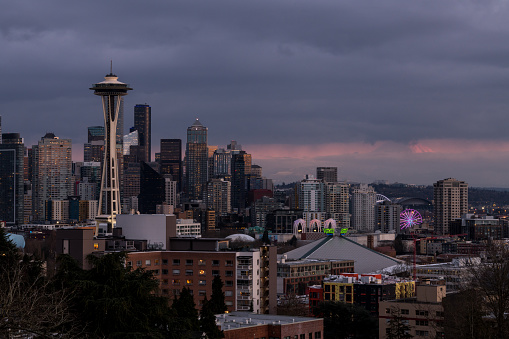 Seattle, USA – Feb 22, 2022: Beautiful sunset over the Seattle with Mount Rainier peeking through the clouds.