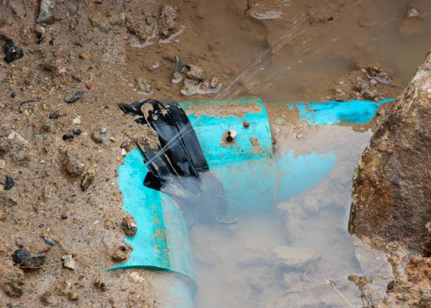 istock plumbing broken plastic pipe in the hole and water in wait repair 1389906633