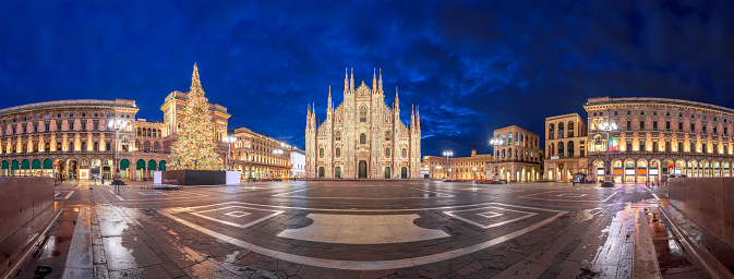 Milan, Italy at the Milan Duomo and Galleria during Christmas time at night.