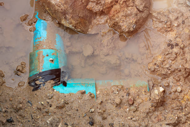 istock plumbing broken plastic pipe in the hole and water in wait repair 1389906649