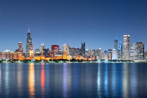 Chicago, Illinois, USA downtown skyline on Lake Michigan at dusk.