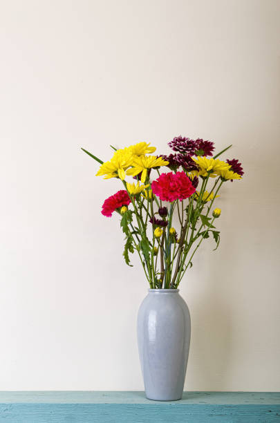 istock single Vase of Flowers on Shelf 1389907153
