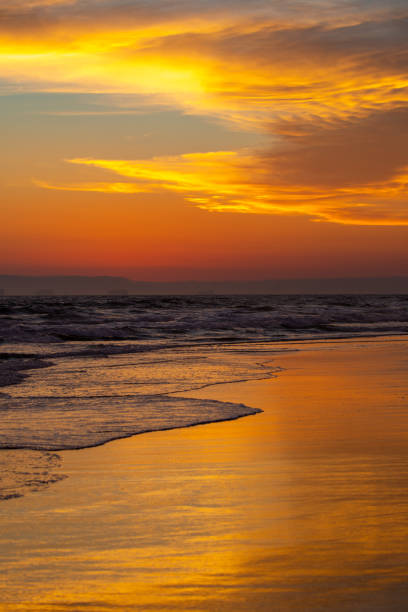 istock Dramatic colorful sunset at Huntington Beach, California 1389908998