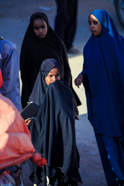 Muslim Woman in Hijab walking on the Capital Streets Hargeisa, Somaliland - November 10, 2019: Muslim Woman in Hijab walking on the Capital Streets hargeysa photos stock pictures, royalty-free photos & images