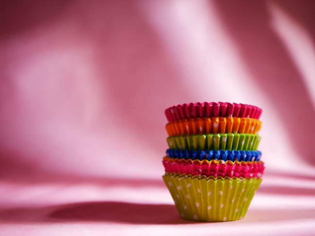 istock Bun cases in different colors for baking on pink background 1389912212