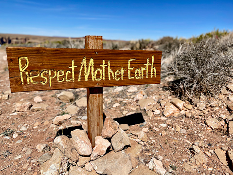 Sign reminds tourists to respect the area around them and pick up after themselves. This sign is located outside of the East Rim of the Grand Canyon National Park.