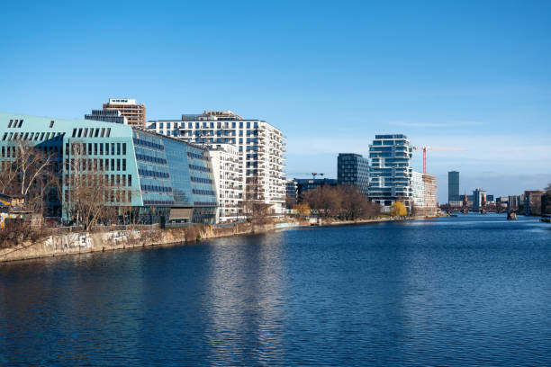 istock Modern apartment buildings at the river Spree in Berlin, Germany 1389914211