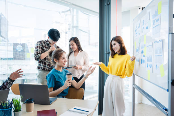 istock Successful business people present analytics reports while working with colleagues in the modern office. 1389916302