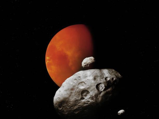 Phobos and Deimos, satellites of the red planet. Mars with asteroids. stock photo