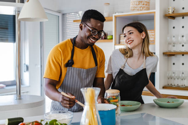 istock Young couple in the kitchen 1389922747
