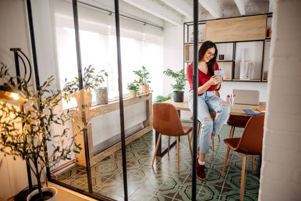 istock Professional businesswoman texting 1389923174