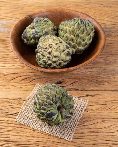 istock Sugar apples or custard apples in a bowl over wooden table 1389928790