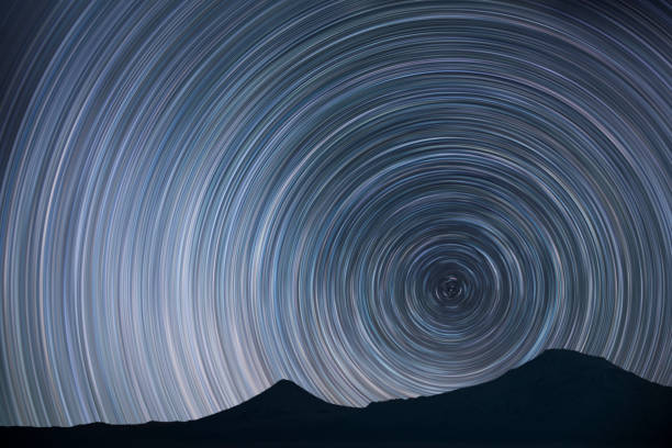 istock Night landscape, star trails over the mountains. 1389930411