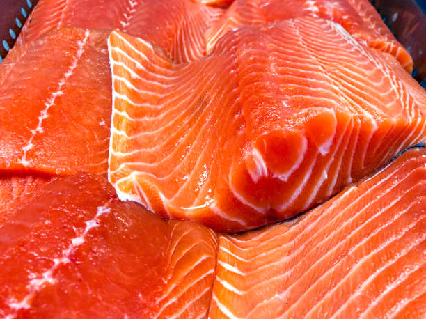 Raw salmon fillet Raw salmon fillet at the fishmonger healthy eating red above studio shot stock pictures, royalty-free photos & images