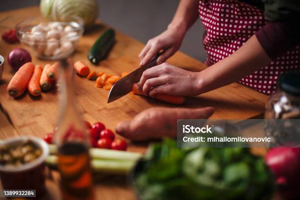 Slicing Carrots Stock Photo - Download Image Now - Vegetable, Cooking, Preparing Food