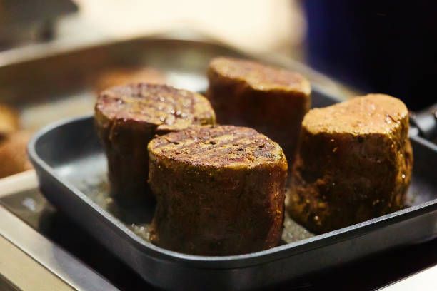 istock The beef steak in a frying pan. Shallow dof 1389935434