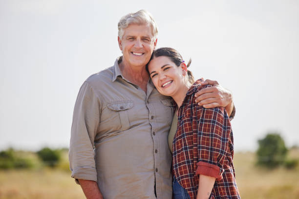 Shot of a man and a woman standing together on a farm We've always been this close the farmer and his wife pictures stock pictures, royalty-free photos & images