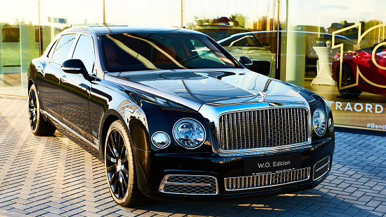 Bentley Flying Spur luxury sedan parked on the street in front of three star Michelin restaurant Librije in Zwolle, Overijssel, Netherlands.