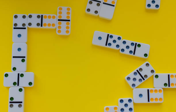 istock Domino board game on yellow background 1389942152