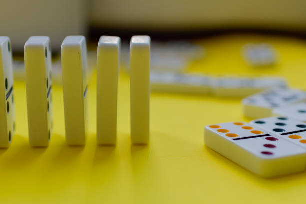 istock Domino board game on yellow background 1389942745