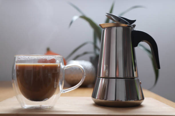 istock coffee pot and a cup of coffee 1389944059