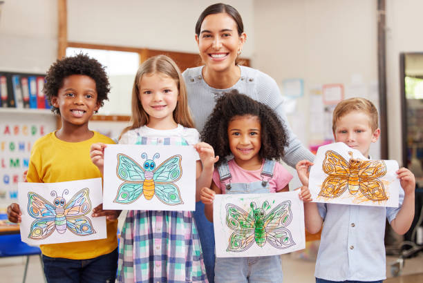 Shot of a young woman teaching a class of preschool children Sending your child to school gives them the chance to blossom child care stock pictures, royalty-free photos & images