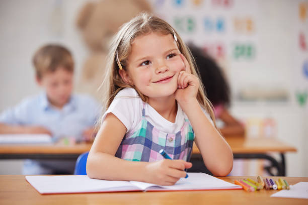 istock Shot of a preschool student looking thoughtful while sitting in class 1389944306
