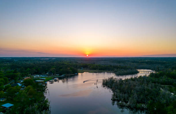 istock Boat on the river at sunset 1389945004