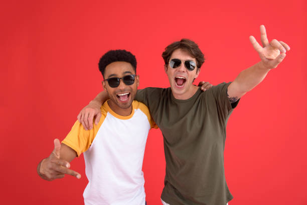istock Young two men friends isolated over red background 1389947240