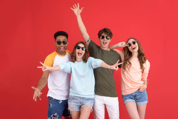 istock Cheerful group of friends standing isolated 1389947260