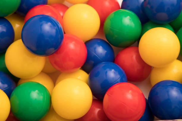 istock Multi-colored plastic balls. A children's balls isolated on white background. 1389949007