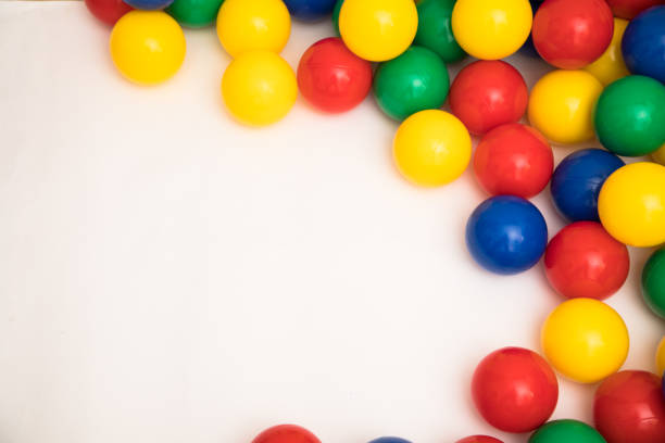 istock Multi-colored plastic balls. A children's balls isolated on white background. 1389949053