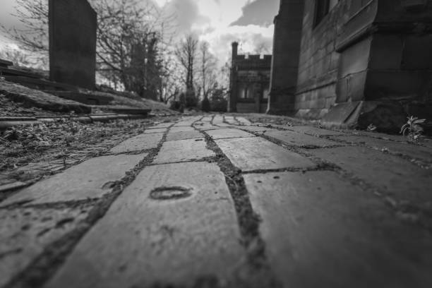 istock Mono shot looking down a path beside a church 1389949141