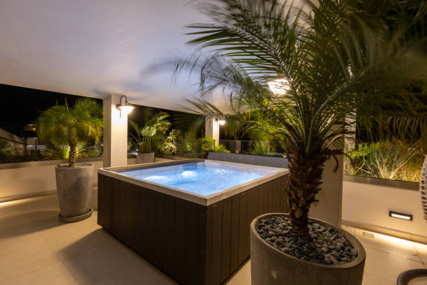 istock Illuminated hydromassage bathtub on the hotel terrace in the evening 1389949790
