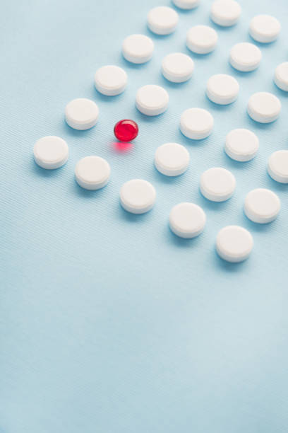 istock Close up of a one red capsule 1389949939