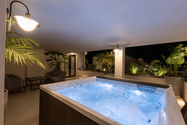 istock Illuminated hydromassage bathtub on the hotel terrace in the evening 1389950981