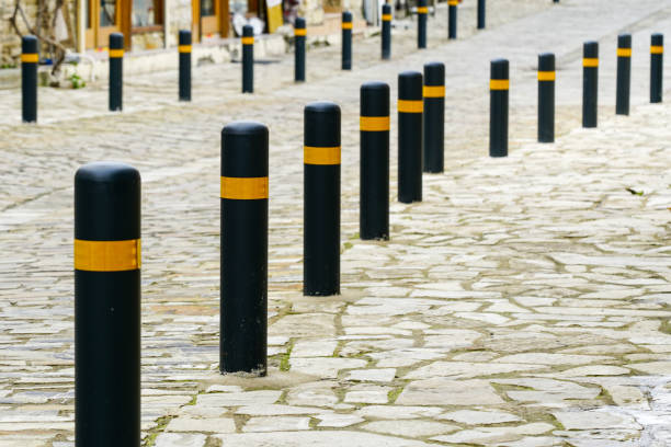 istock black and yellow colored columns for protection the sidewalk from the road 1389951170