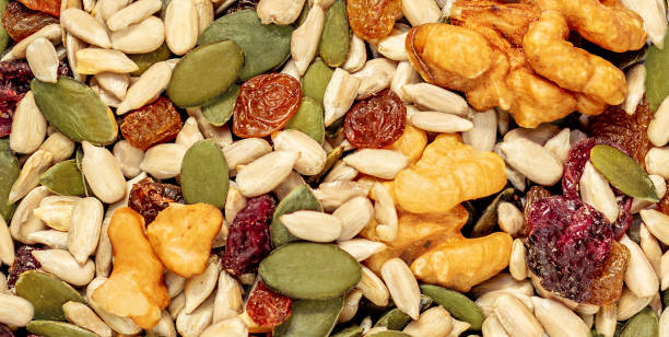 istock Nuts and seeds as a  background. Pattern  of granola or muesli Top view 1389952789