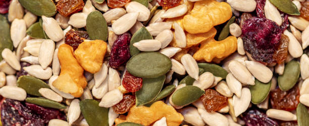 istock Nuts and seeds as a  background. Pattern  of granola or muesli Top view 1389952810