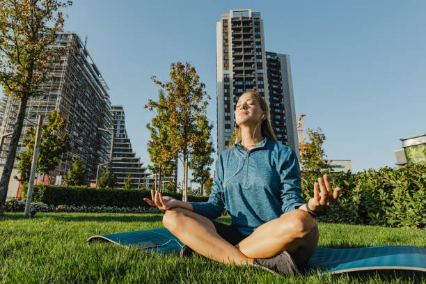 istock Mental wellbeing and meditating in park 1389954581