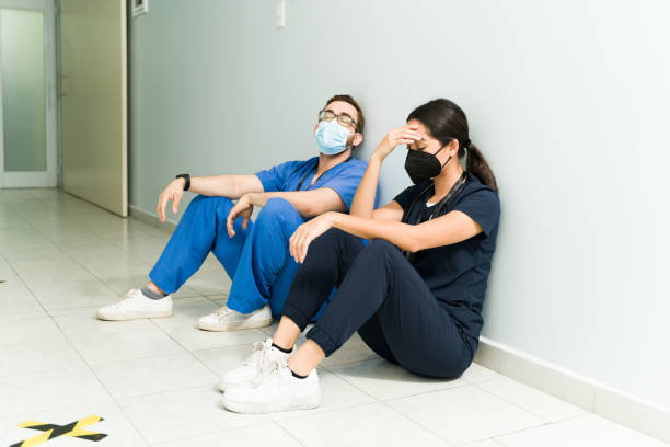 istock Tired doctors resting in the hospital 1389954595