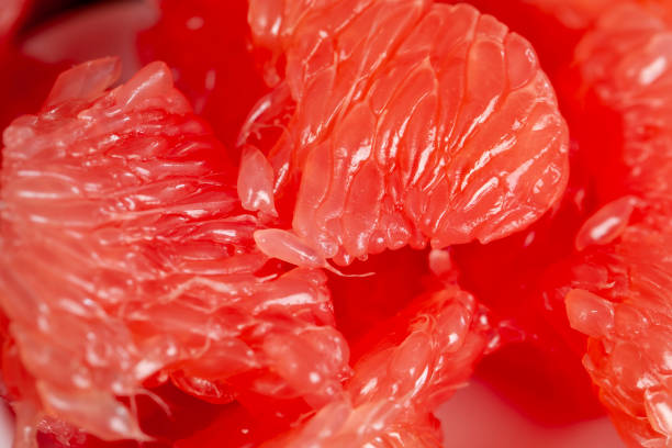 istock peeled and divided into parts ripe red grapefruit 1389954919