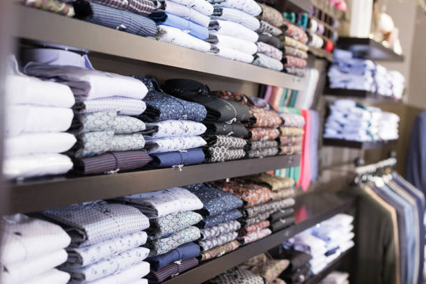 istock Men shirts displayed on shelves in shop 1389955750