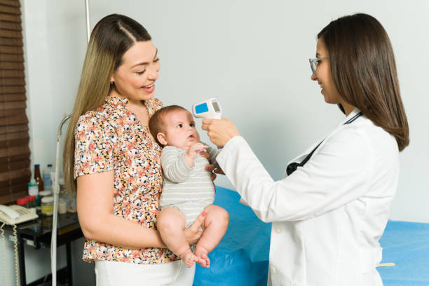 istock Cute baby getting a medical check-up 1389958069
