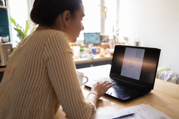 istock Woman Doing Finances at Home 1389971235