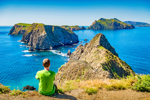 Man enjoys the dramatic view on Anacapa Island in Channel Islands National Park near Los Angeles, California, USA.