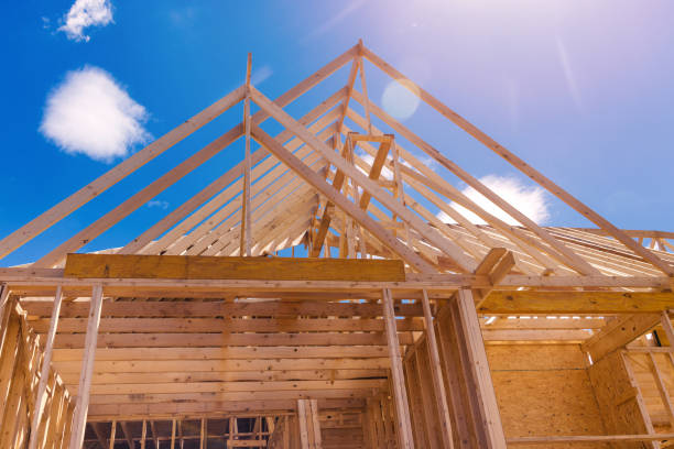 istock Roofing installing house roof beams for roofing under construction 1389974403